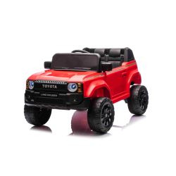 Električni avtomobilček Toyota Landcruiser 12V, rdeč, širok enojni sedež, 2,4 GHz daljinski upravljalnik, USB/AUX vhod, Bluetooth, vzmetenje, litijeva baterija, LED luči, 2 X 25W motor, ORIGINALNA registracija