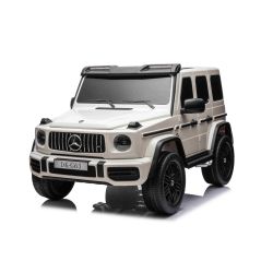 Električni avto Mercedes-Benz G63 AMG 4x4² Dvosed 12V, bel, MP3 predvajalnik z USB/AUX vhodom, 4x4 pogon, Akumulator 12V14Ah, EVA platišča z vzmetenjem, Usnjeni sedeži, Daljinec, Licenca
