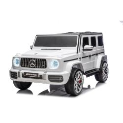 Električni avtomobilček Mercedes-Benz G63 AMG 4x4 Dvosedežni 24V, bel, MP3 predvajalnik z USB/AUX in Bluetooth povezavo, 4x4 pogon, litijeva baterija, EVA kolesa z vzmetenjem, Usnjeni sedeži, Daljinski upravljalnik, Registrirana vozila