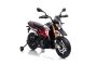 Električni motocikel APRILIA DORSODURO 900, Licenca, 12V baterija, EVA mehka kolesa, 2 x 18W motor, Vzmetenje, kovinski okvir, kovinske vilice, pomožna kolesa, rdeča